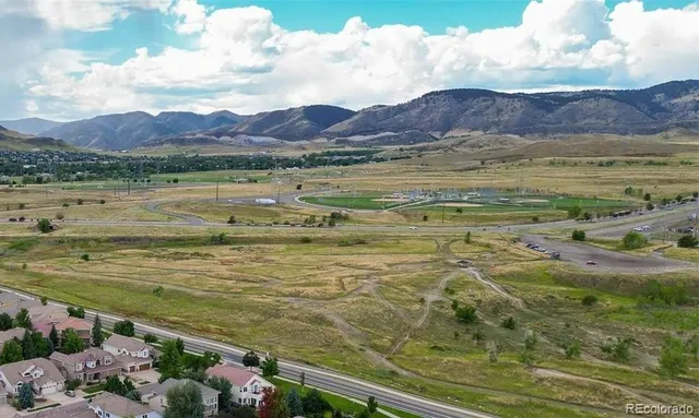 a view of an ocean and a mountain