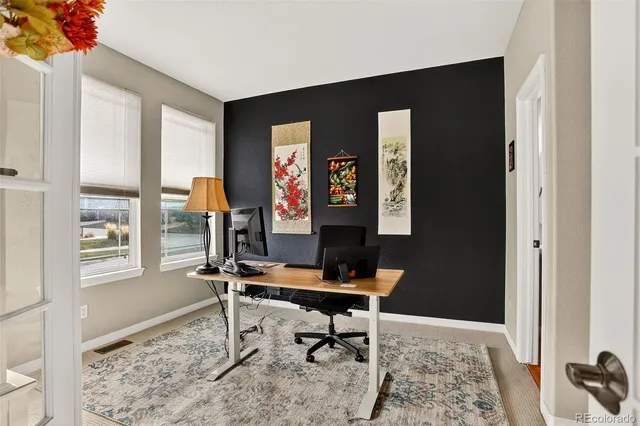 a view of a livingroom with furniture and windows