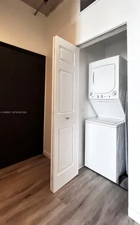 an entryway with wooden floor