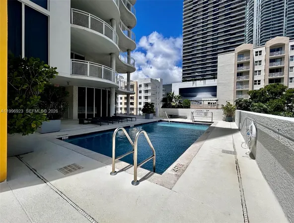 a view of a patio with a table and chairs