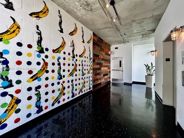 a view of entryway with stairs and wooden floor