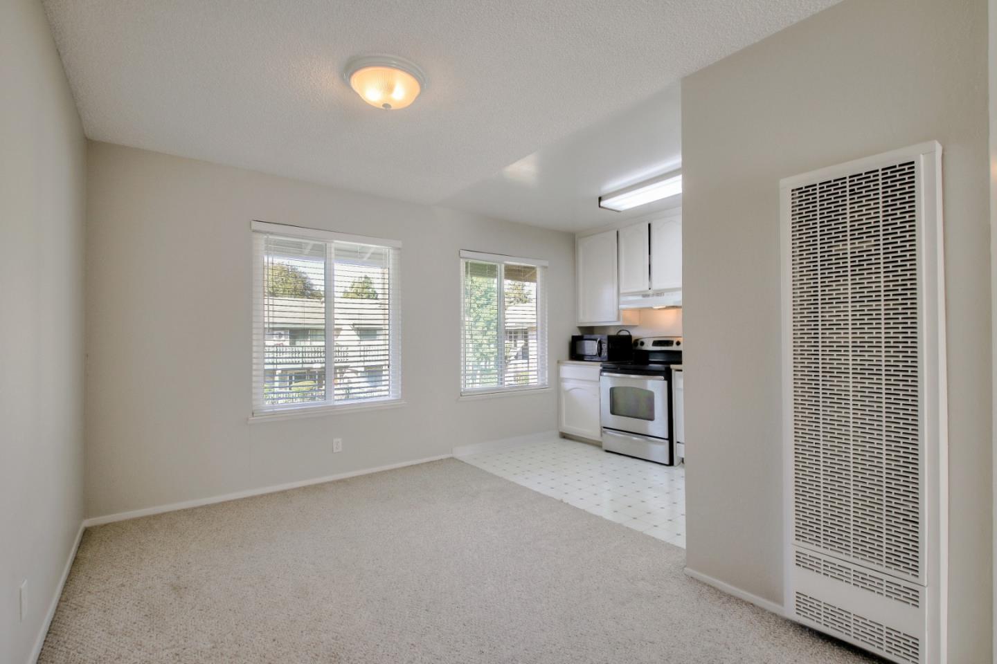 4888 Clayton Road, Unit 31 Concord, CA 94521 - Photo 12 of 23 a kitchen with cabinets and window