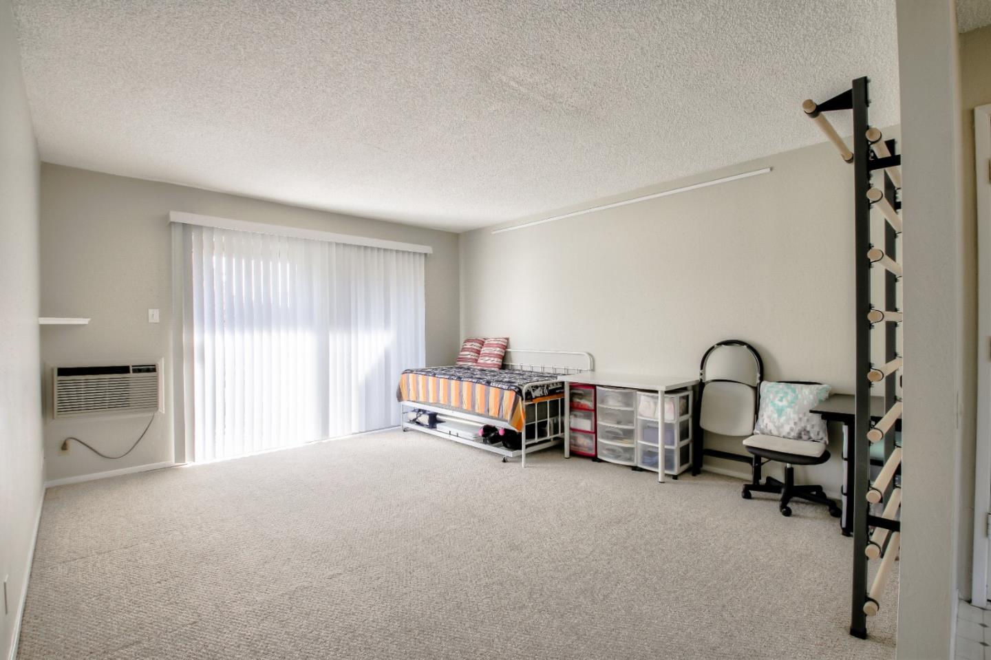 4888 Clayton Road, Unit 31 Concord, CA 94521 - Photo 14 of 23 a bedroom with furniture and a window