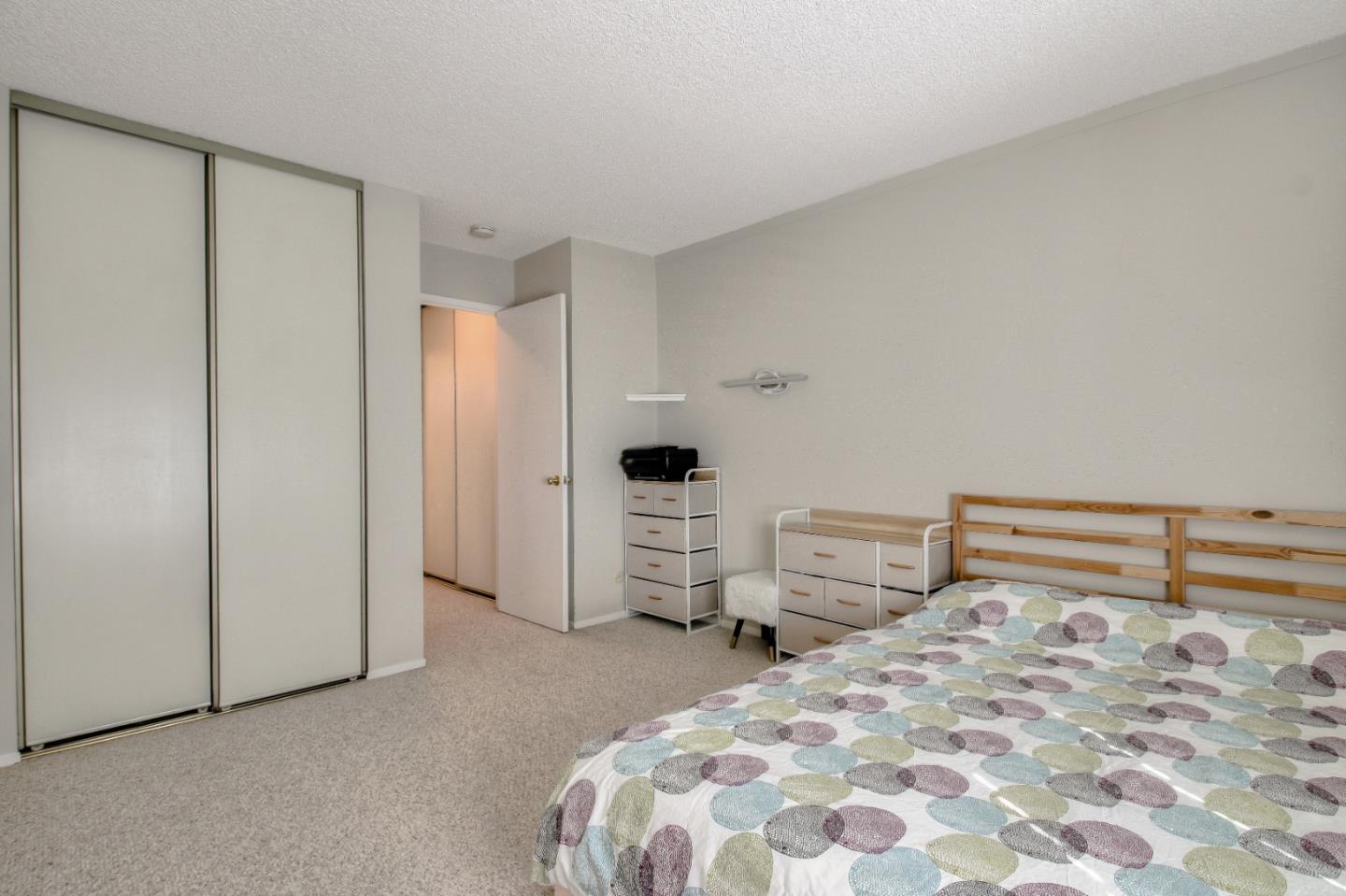 4888 Clayton Road, Unit 31 Concord, CA 94521 - Photo 16 of 23 a bedroom with a bed and cabinets