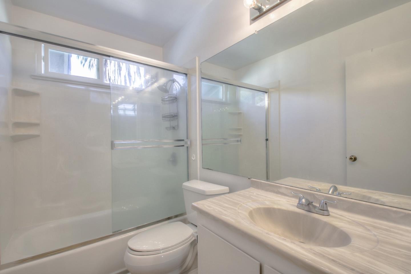 4888 Clayton Road, Unit 31 Concord, CA 94521 - Photo 17 of 23 a bathroom with a sink a toilet and shower
