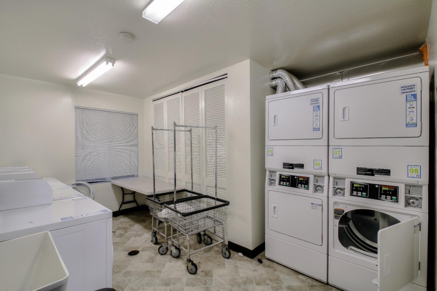 4888 Clayton Road, Unit 31 Concord, CA 94521 - Photo 18 of 23 a view of a storage and utility room with washer and dryer