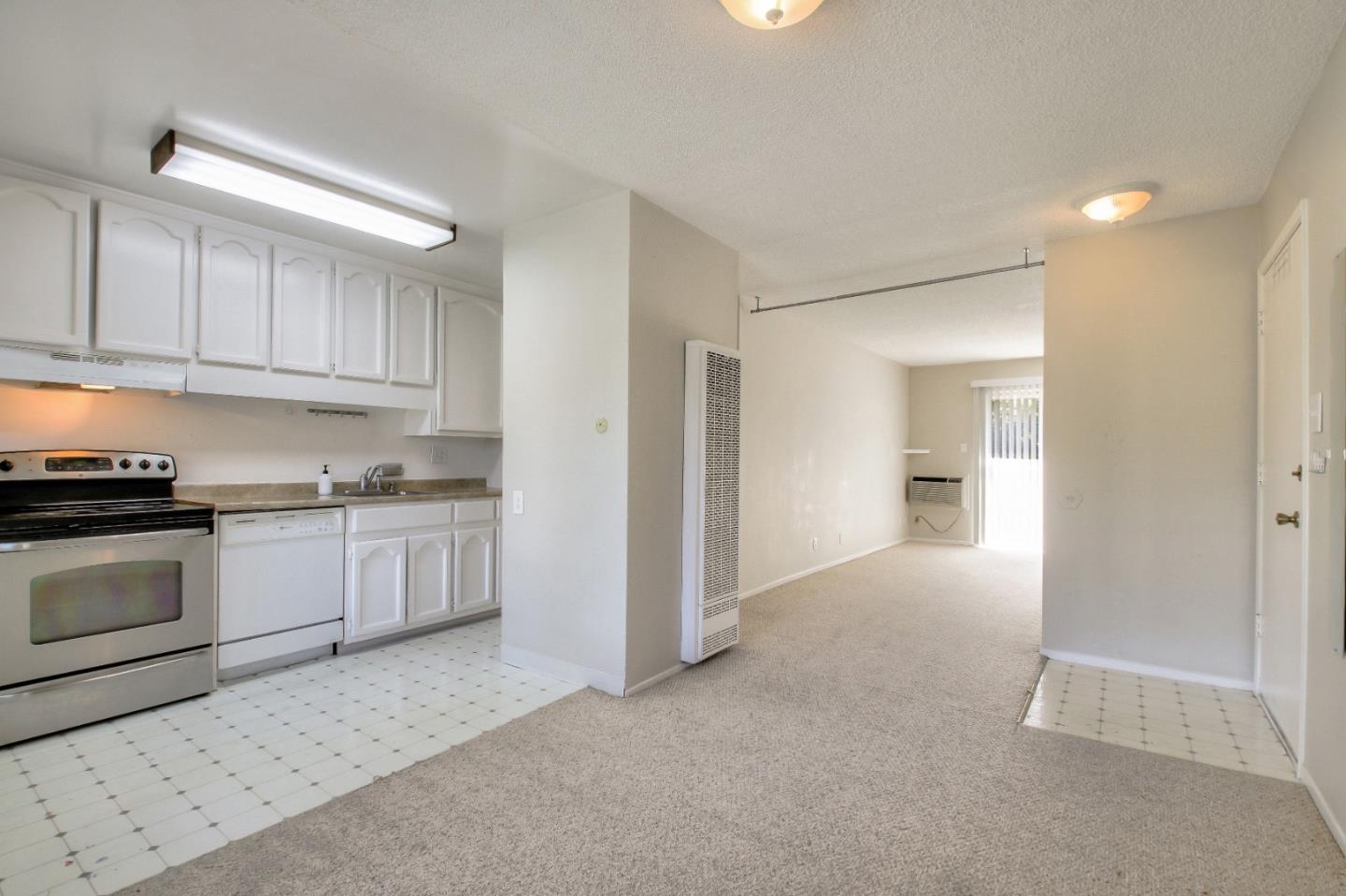 4888 Clayton Road, Unit 31 Concord, CA 94521 - Photo 6 of 23 a kitchen with granite countertop white cabinets and white appliances