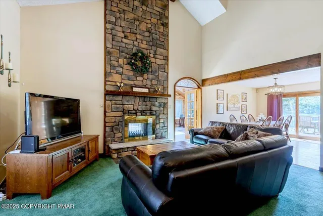 a view of a lake with a car parked on the road