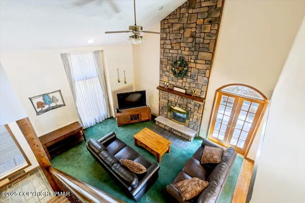 a kitchen with stainless steel appliances granite countertop a sink stove and wooden cabinets