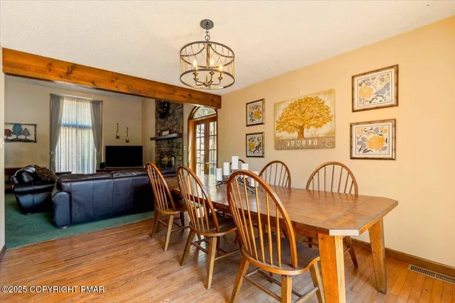 a large white kitchen with lots of counter space and a sink