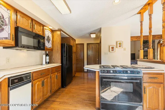 a view of a large house with a yard and lawn chairs