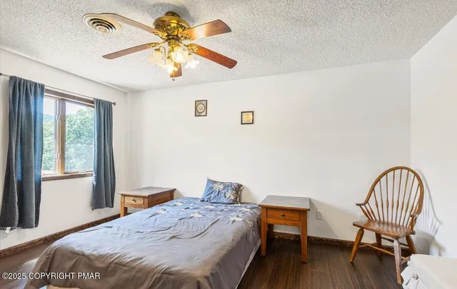 a view of a garden with a building in the background