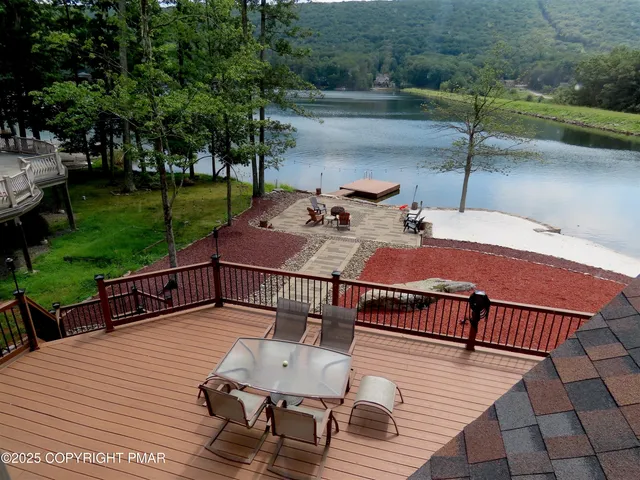 an aerial view of a houses with ocean view
