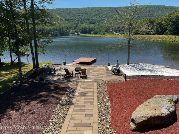 a view of a swimming pool with a patio