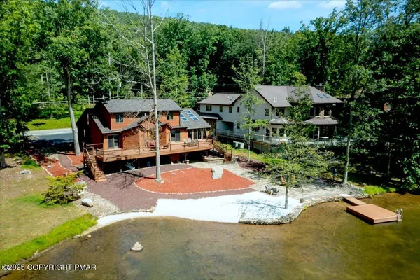 a view of a backyard with swimming pool