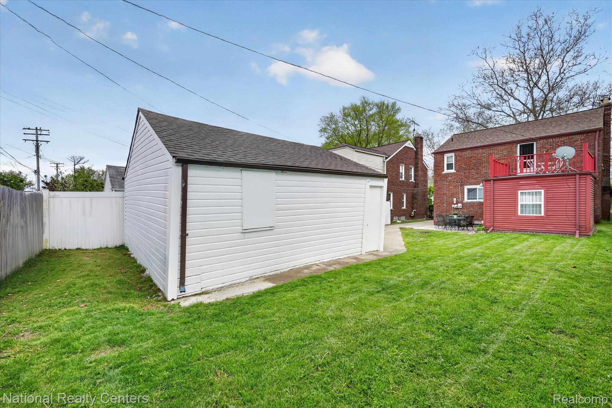 3956 Harvard Road Detroit, MI 48224 - Photo 36 of 44 View of green lawn with an outbuilding