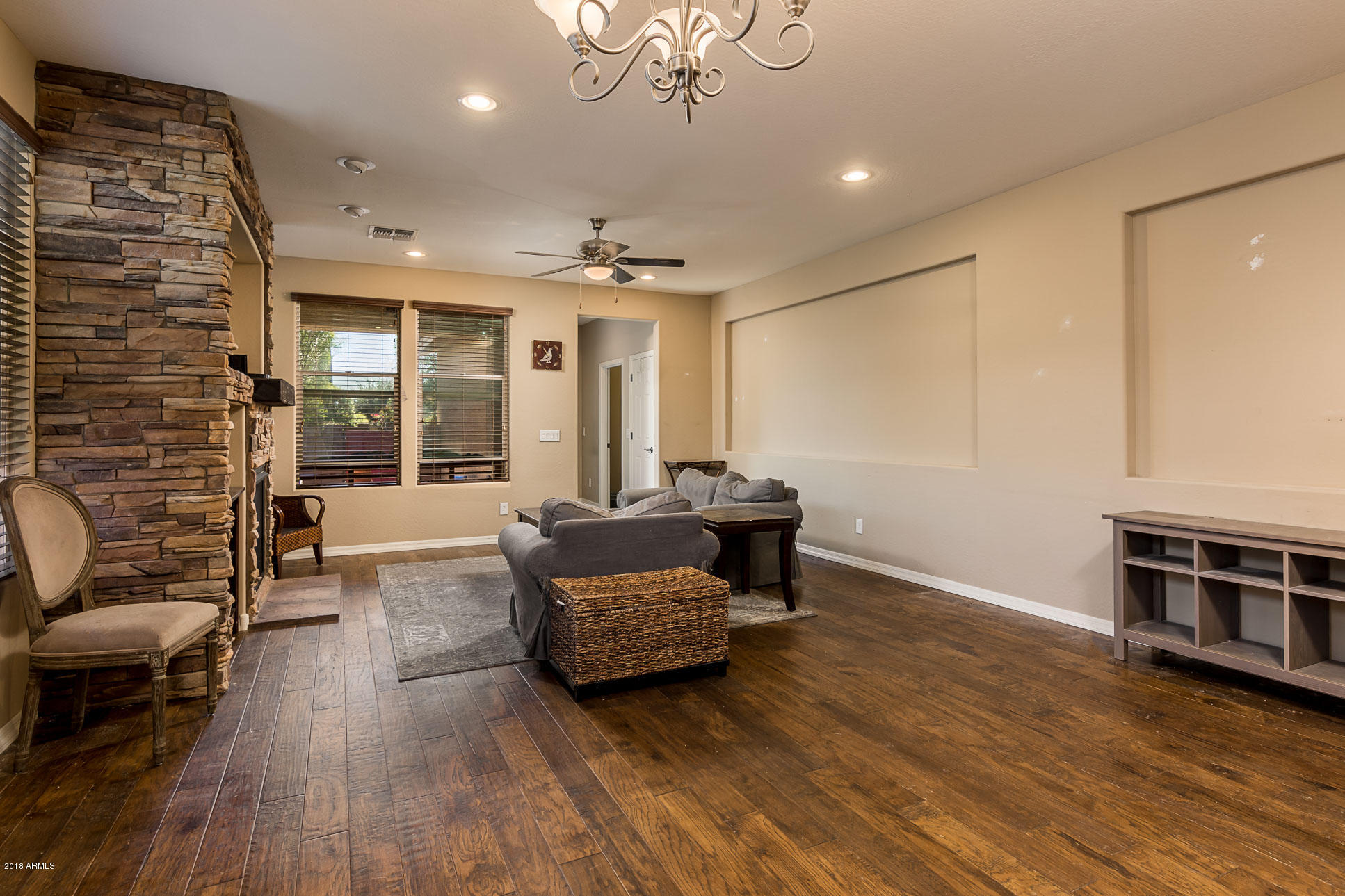 20705 West Ridge Road Buckeye, AZ 85396 - Photo 12 of 26 a living room with furniture and a wooden floor
