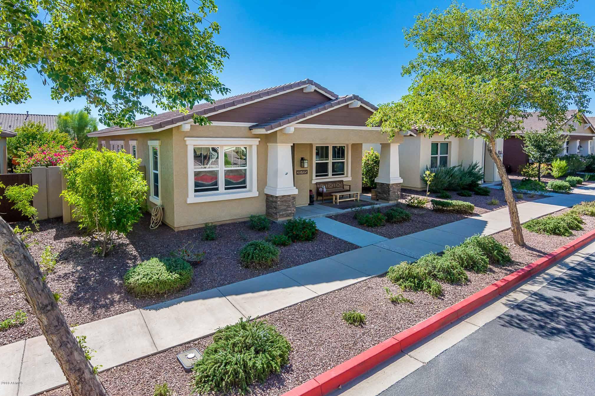 20705 West Ridge Road Buckeye, AZ 85396 - Photo 2 of 26 a front view of a house with garden