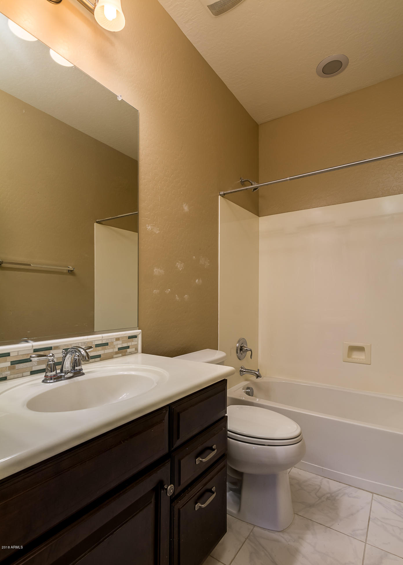 20705 West Ridge Road Buckeye, AZ 85396 - Photo 21 of 26 a bathroom with a sink a toilet and shower