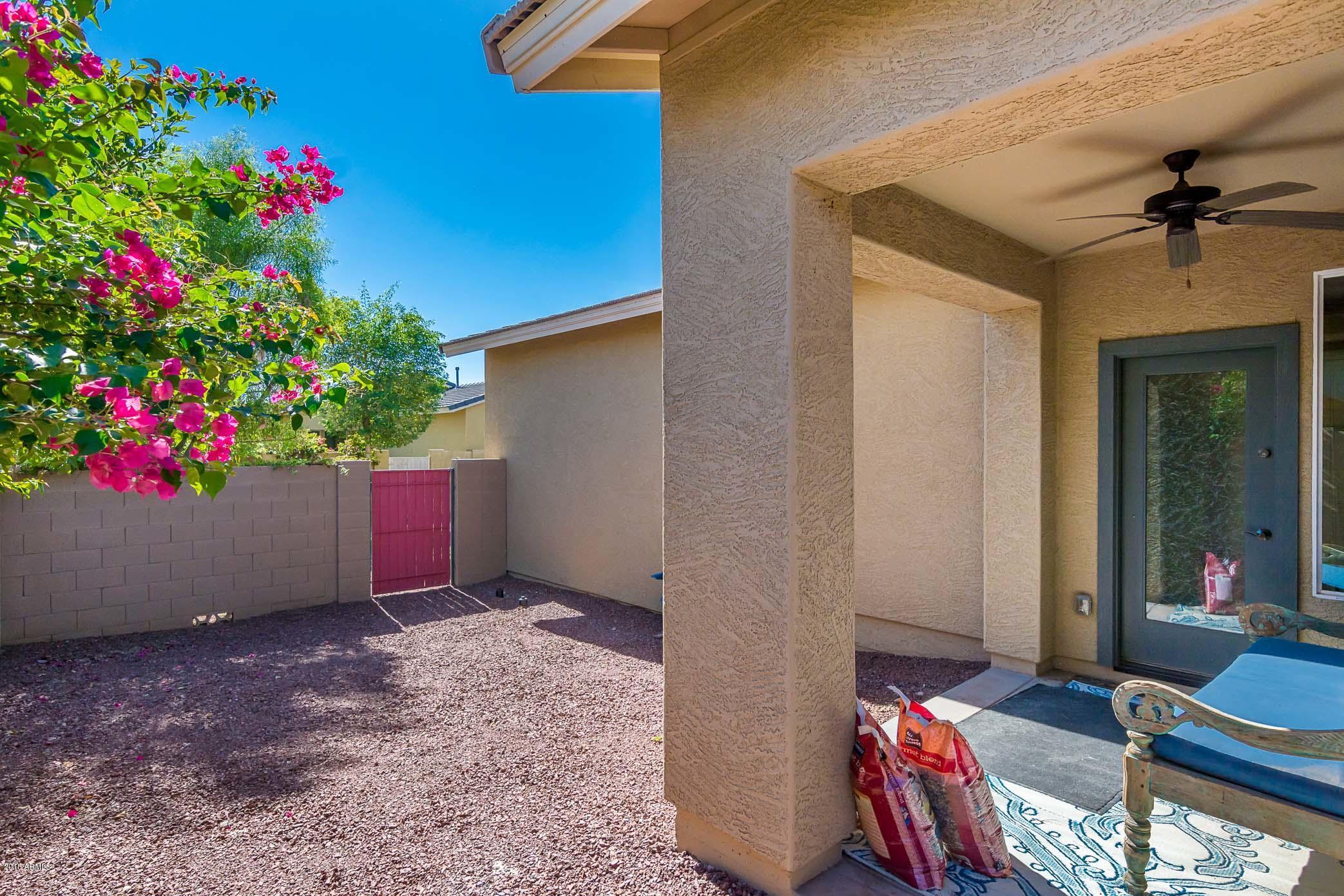 20705 West Ridge Road Buckeye, AZ 85396 - Photo 22 of 26 a view of an entryway with flower pots