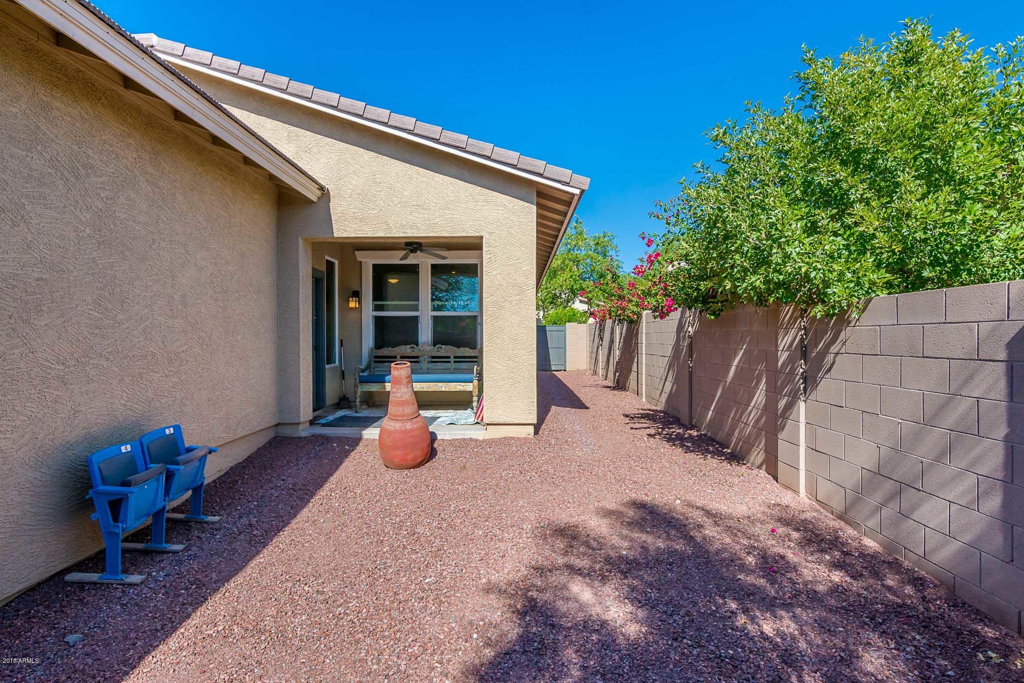 20705 West Ridge Road Buckeye, AZ 85396 - Photo 24 of 26 a view of a house with backyard and sitting area