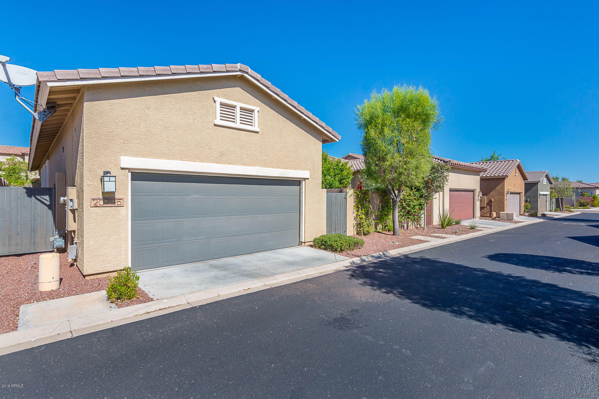 20705 West Ridge Road Buckeye, AZ 85396 - Photo 25 of 26 a front view of a house with garden