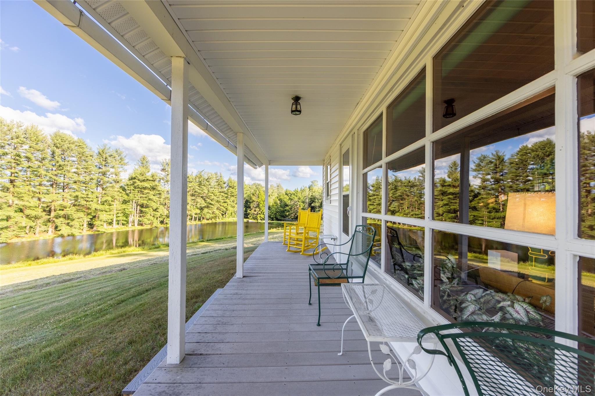 49 Crumley Van Vactor Road Ferndale, NY 12734 - Photo 45 of 50 Wooden porch featuring a water view, a yard, and view of wooded area