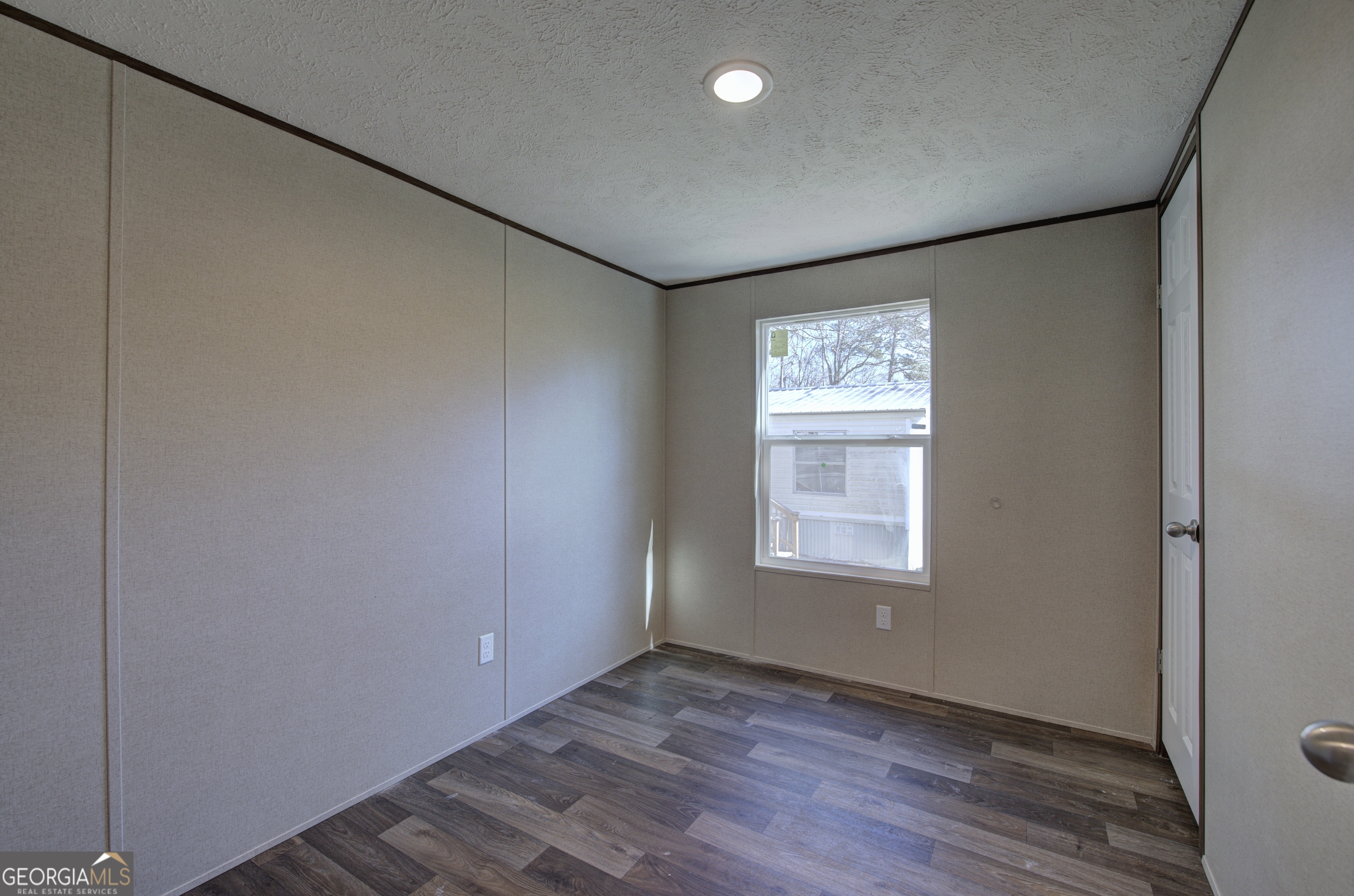 235 A West Big Indian Trail Rome, GA 30165 - Photo 13 of 28 an empty room with wooden floor and window