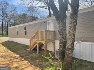 235 A West Big Indian Trail Rome, GA 30165 - Photo 15 of 28 a view of a house with a yard