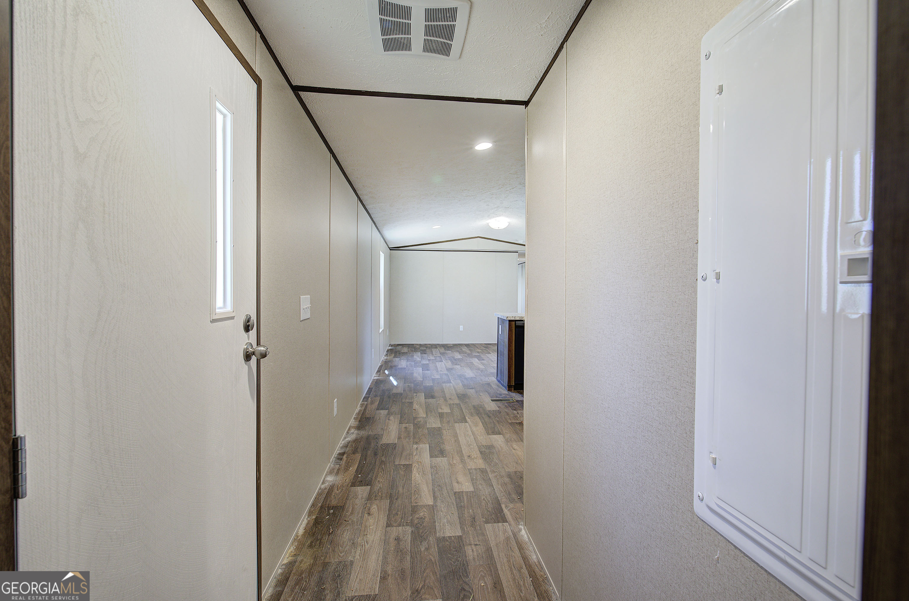 235 A West Big Indian Trail Rome, GA 30165 - Photo 17 of 28 a view of a hallway with wooden floor and staircase