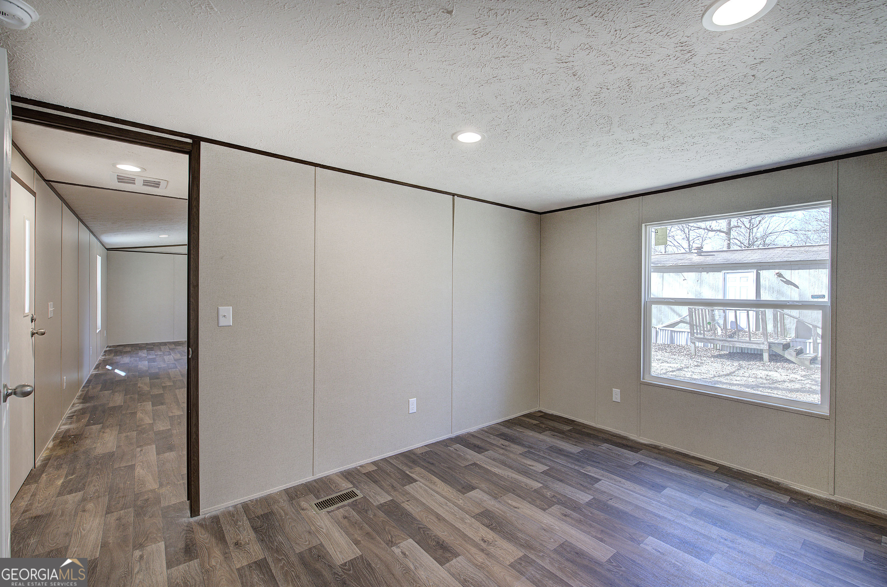 235 A West Big Indian Trail Rome, GA 30165 - Photo 20 of 28 a view of empty room with wooden floor and fan