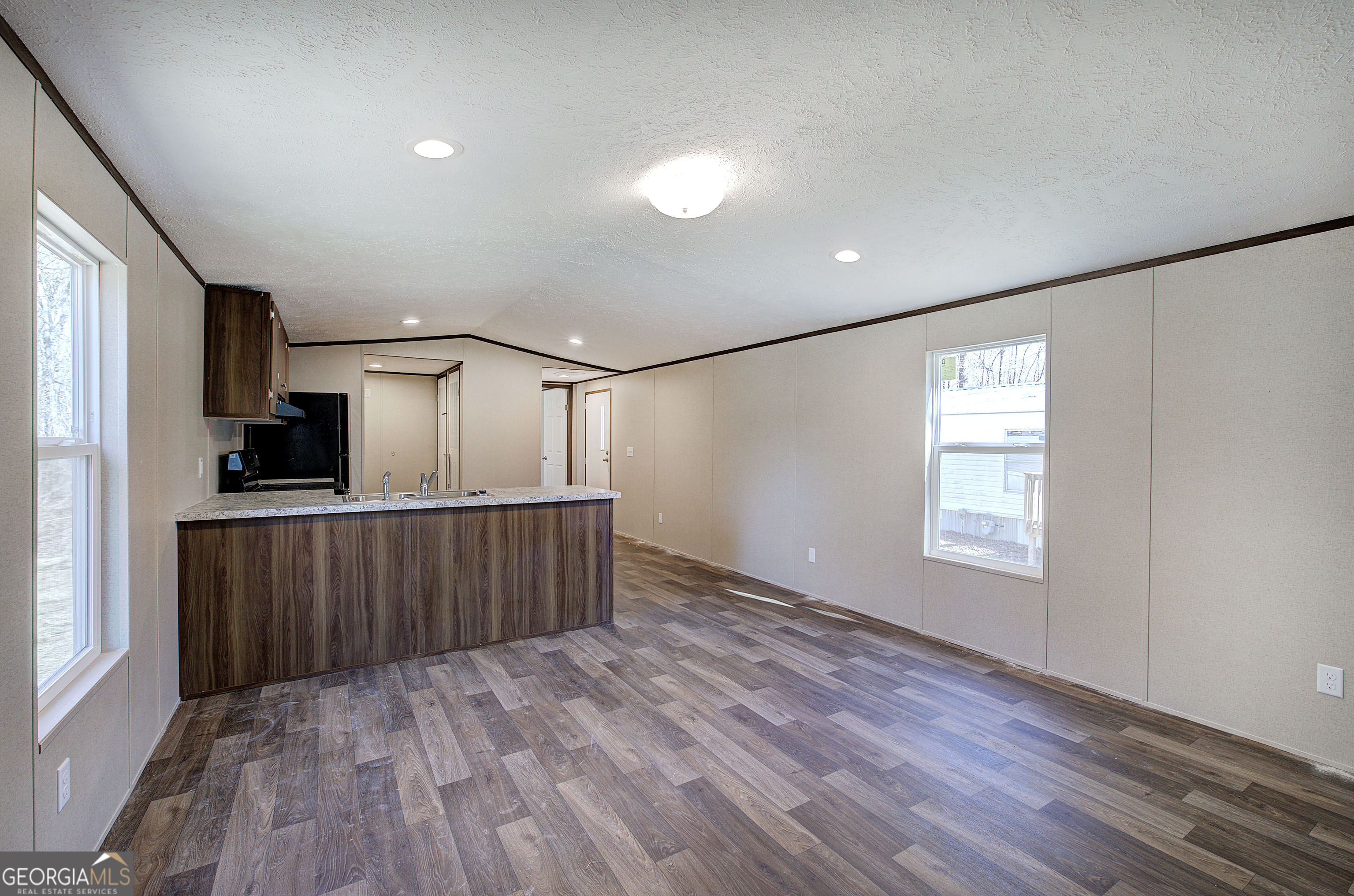 235 A West Big Indian Trail Rome, GA 30165 - Photo 2 of 28 a view of hallway with stairs and wooden floor