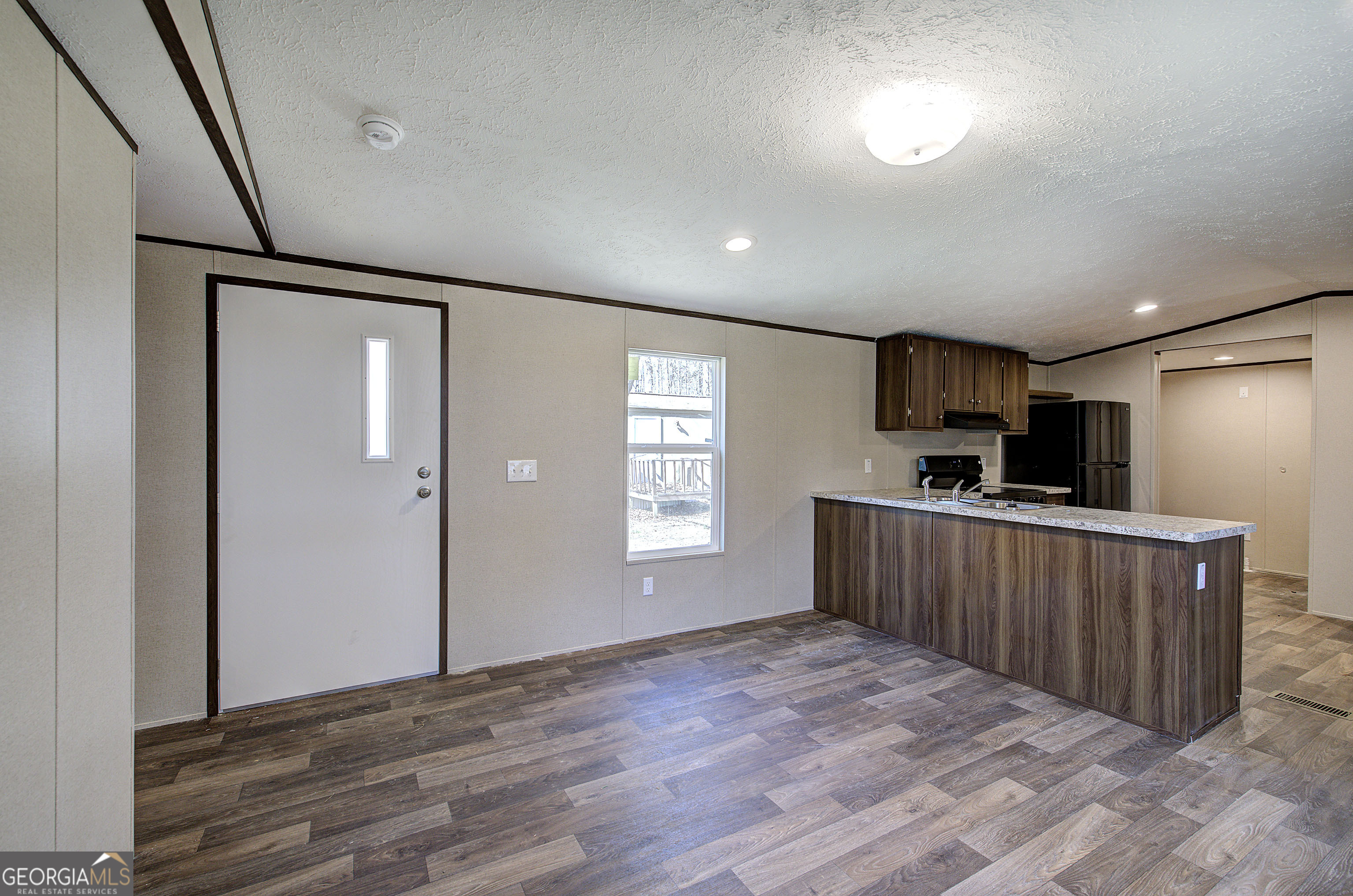 235 A West Big Indian Trail Rome, GA 30165 - Photo 25 of 28 a view of empty room with kitchen and window