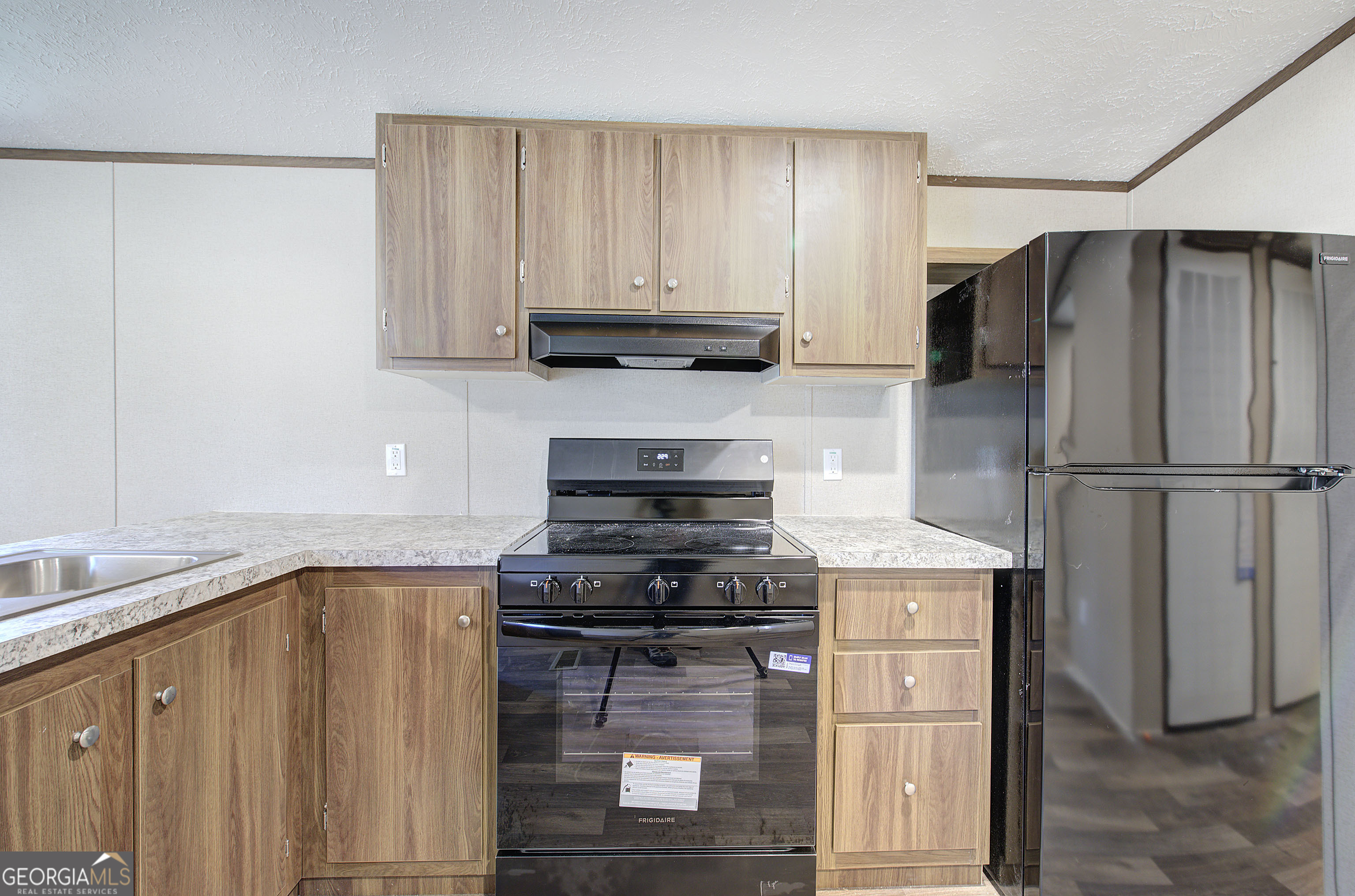 235 A West Big Indian Trail Rome, GA 30165 - Photo 5 of 28 a kitchen with a refrigerator sink and cabinets