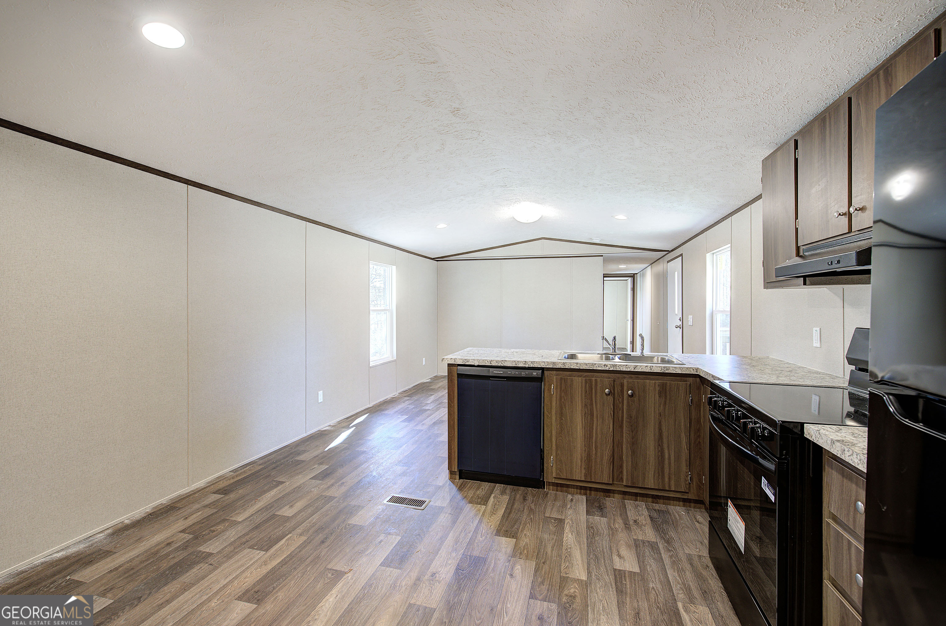 235 A West Big Indian Trail Rome, GA 30165 - Photo 7 of 28 a kitchen with wooden cabinets and a sink
