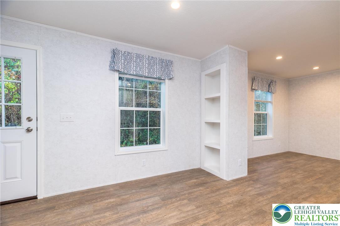 465 Royal Manor Road, Unit LOT 1 Easton, PA 18042 - Photo 13 of 15 an empty room with wooden floor and windows