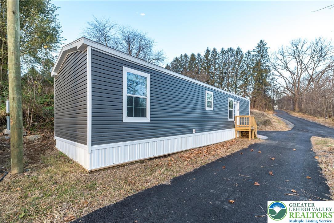 465 Royal Manor Road, Unit LOT 1 Easton, PA 18042 - Photo 14 of 15 a view of a house with a yard