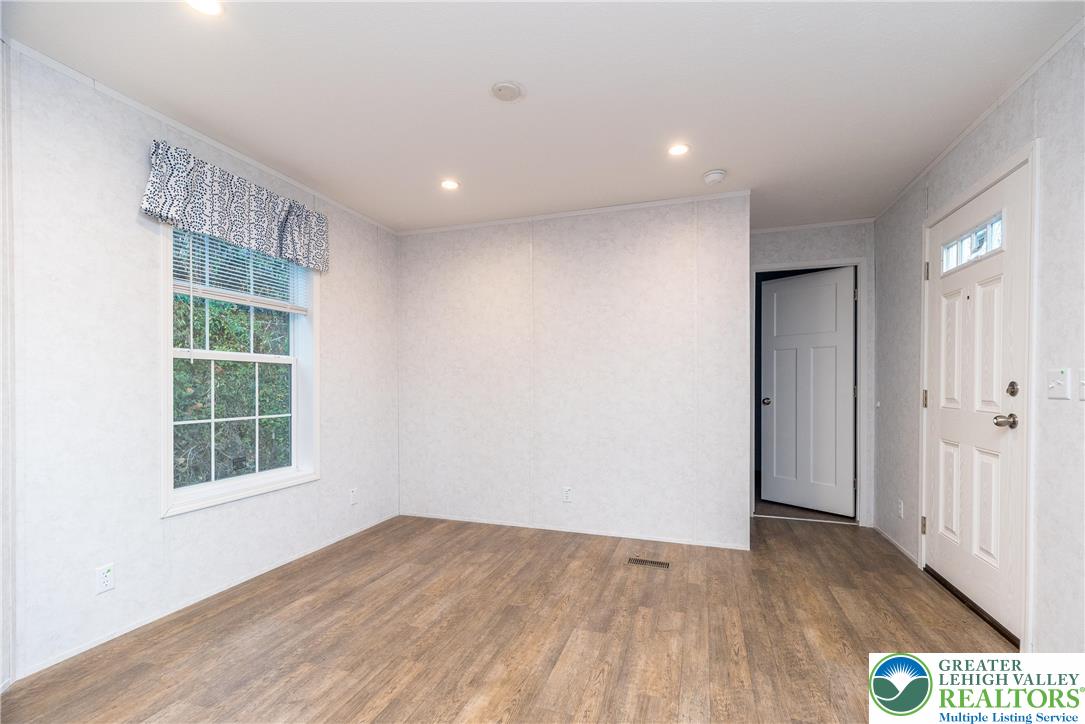 465 Royal Manor Road, Unit LOT 1 Easton, PA 18042 - Photo 7 of 15 a view of empty room with wooden floor and fan