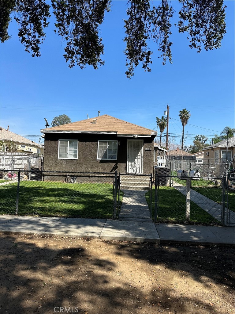 4156 Dwight Avenue Riverside, CA 92507 - Photo 1 of 1 2 homes- 1 property! In this photo you will see the front unit 4156. Both homes have a chain link gate around them. Front unit and back unit have seperated yard space.