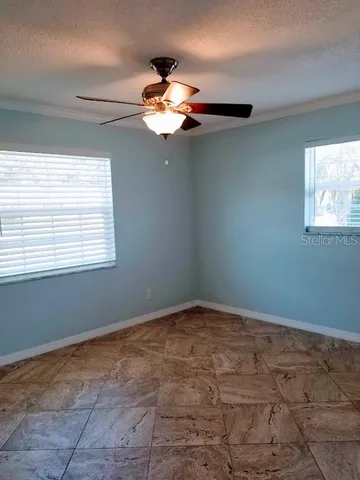 a view of a room with a fan