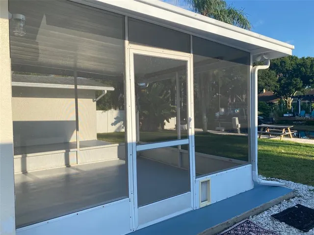 a view of a house with a backyard