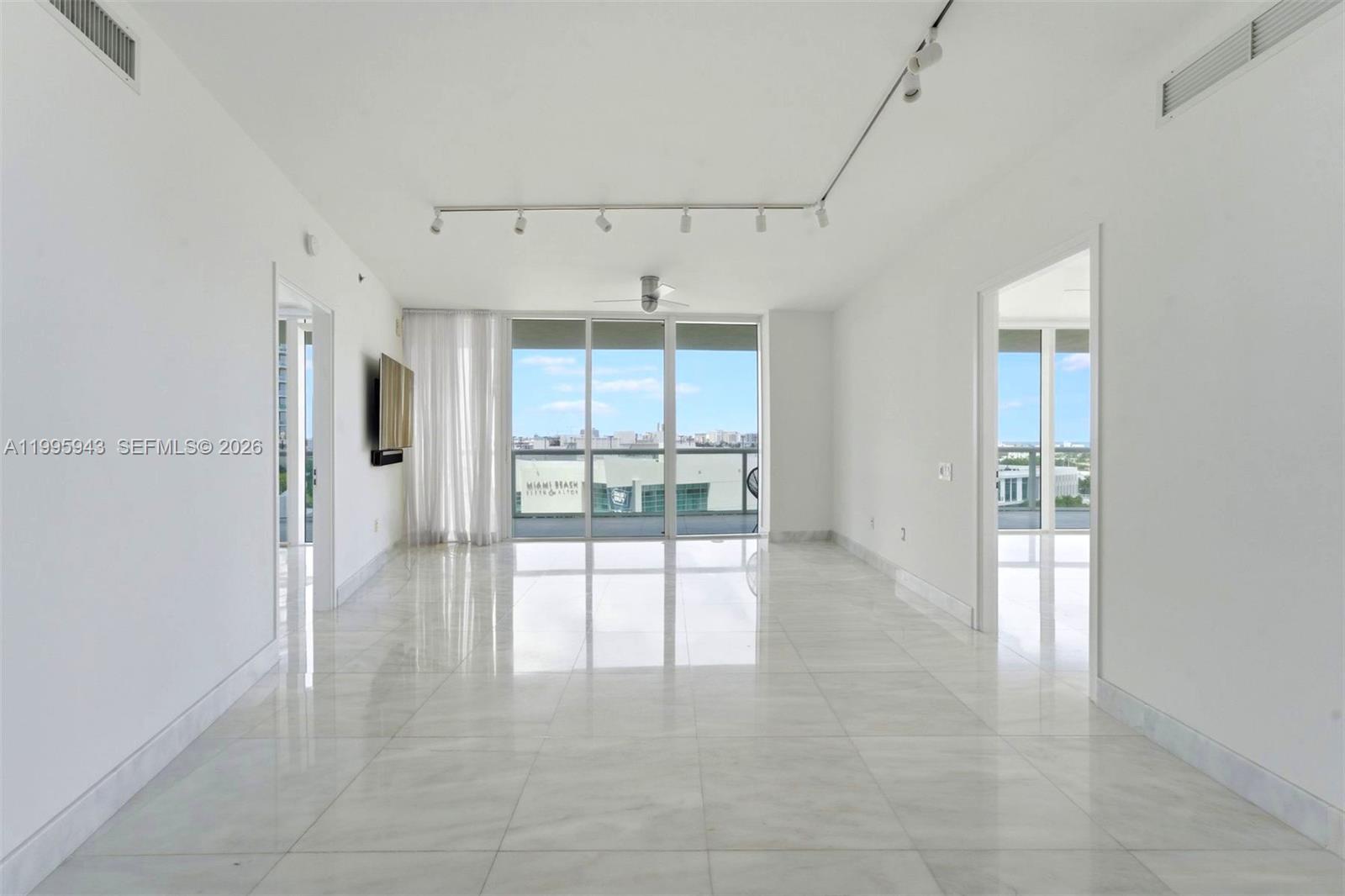 450 Alton Road, Unit 910 Miami Beach, FL 33139 - Photo 26 of 59 a view of an empty room with a window