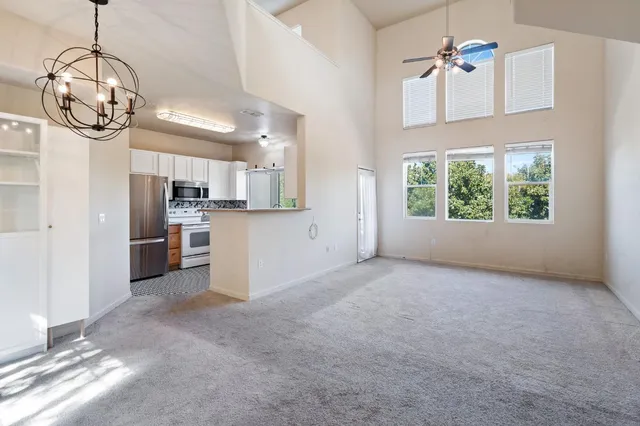 a view of a kitchen with furniture and a window