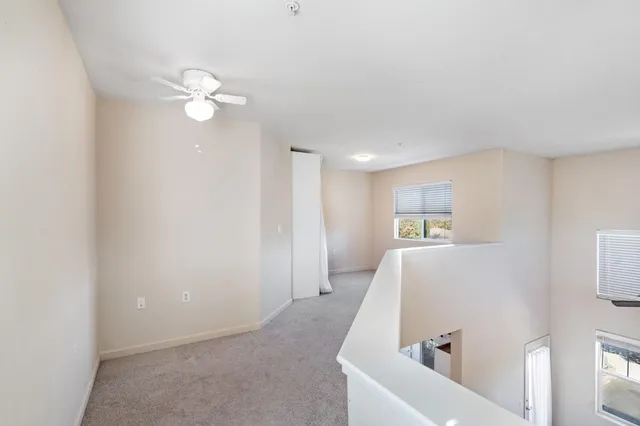 a view of a bedroom with baby bed