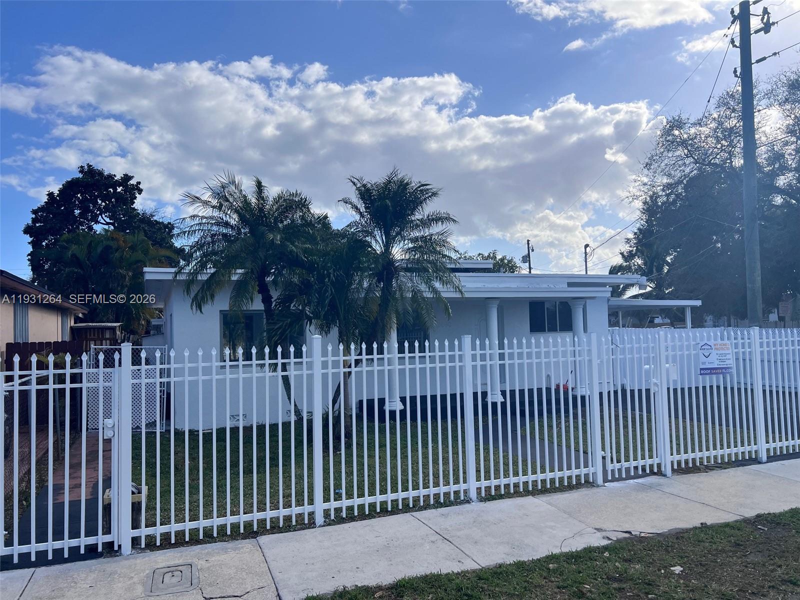 a view of a wrought iron fences in front of house