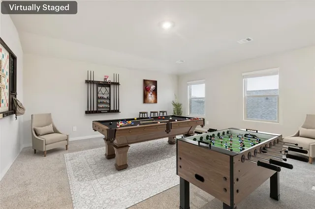 a living room with furniture and a rug