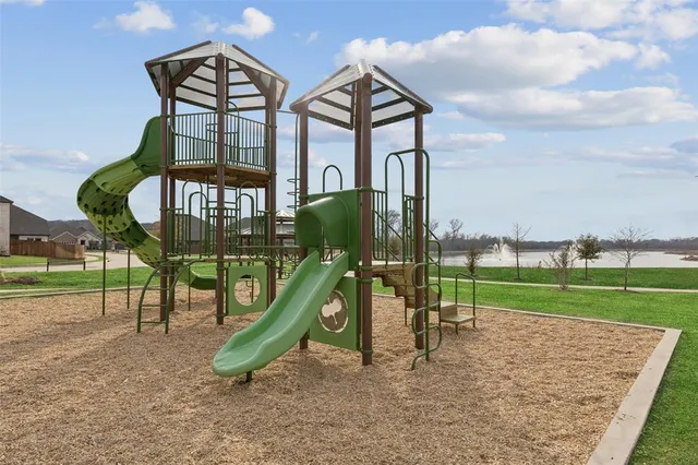 a view of a golf course with a lake