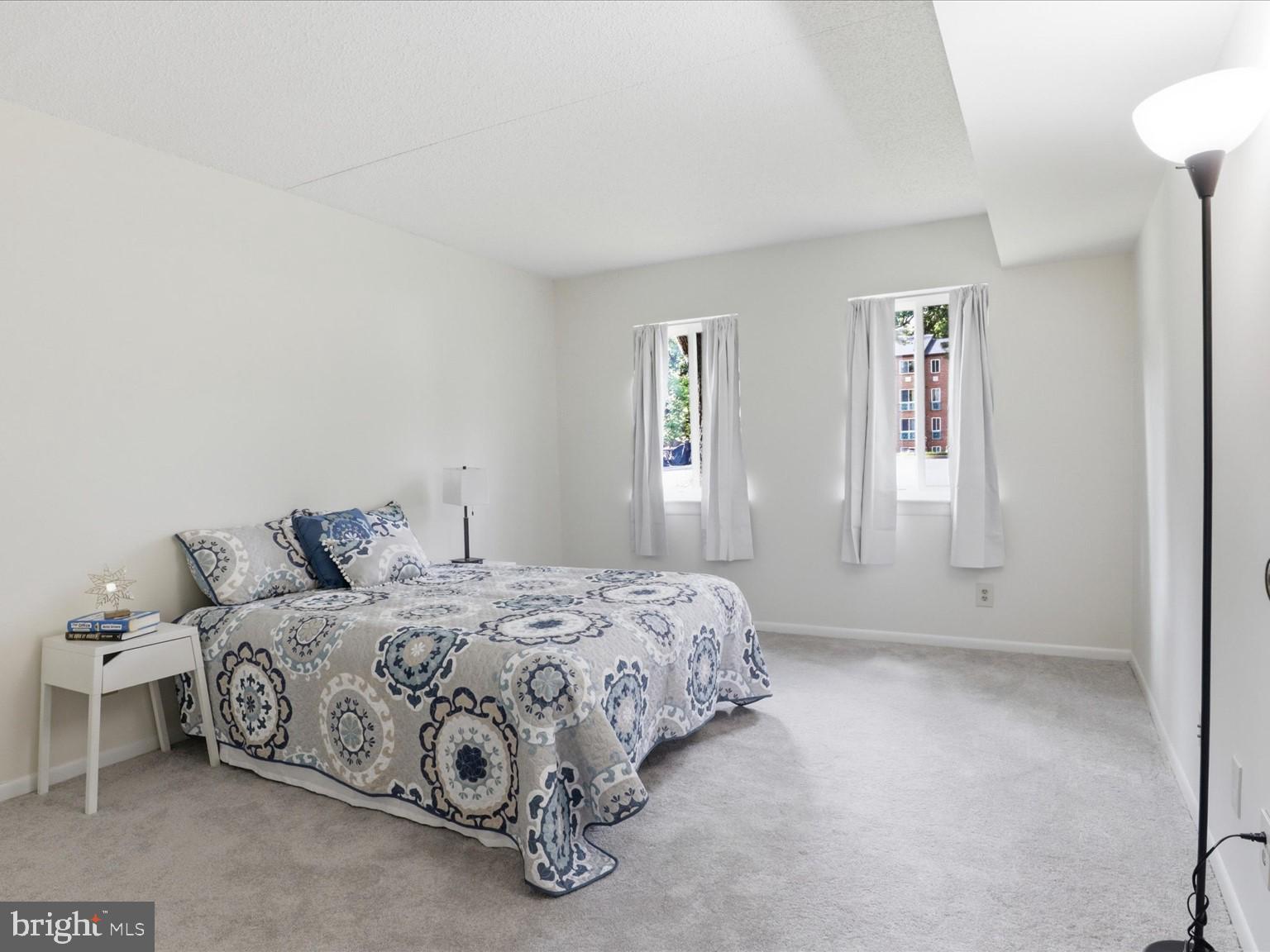 11809 Breton Court, Unit 2B Reston, VA 20191 - Photo 17 of 29 a bedroom with a bed and window