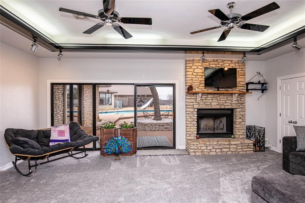 735 Willow Grove Road Woodway, TX 76712 - Photo 11 of 39 a living room with furniture and a fireplace