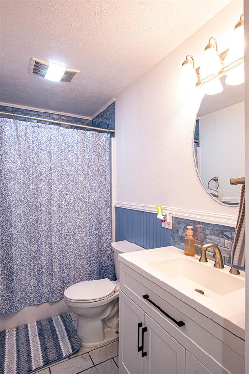 735 Willow Grove Road Woodway, TX 76712 - Photo 22 of 39 a bathroom with a sink a toilet and a mirror
